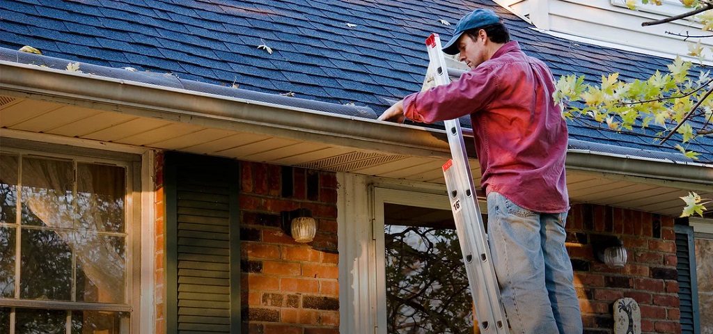 How do you clean roof gutters safely?