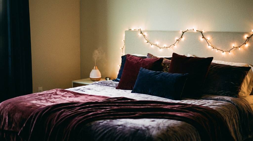 Romantic bedroom with soft lighting and cozy bedding